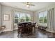 Cozy bar area filled with natural light, comfortable seating, and serene backyard views at 305 Decanting Ln, Fort Mill, SC 29707