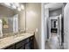 Bathroom with granite countertop vanity and a view to the hall and bedroom at 305 Decanting Ln, Fort Mill, SC 29707