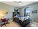 Comfortable bedroom with a black wooden bed, grey walls, and desk at 305 Decanting Ln, Fort Mill, SC 29707