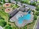 Aerial view of community pool with slides, mushroom fountains, and ample seating at 305 Decanting Ln, Fort Mill, SC 29707