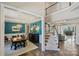 Dining room boasts stylish light fixture, wainscoting, and seamlessly connects to the living spaces at 305 Decanting Ln, Fort Mill, SC 29707