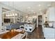 Open kitchen and living area with modern fixtures, island, and ample cabinet space at 305 Decanting Ln, Fort Mill, SC 29707