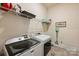 Functional laundry room with modern Maytag washer and dryer at 305 Decanting Ln, Fort Mill, SC 29707