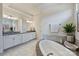 Large main bathroom with soaking tub and granite countertops at 305 Decanting Ln, Fort Mill, SC 29707