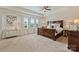 Spacious main bedroom with tray ceiling and ample natural light from large windows at 305 Decanting Ln, Fort Mill, SC 29707
