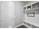 Charming mudroom with white storage, bench, and motivational wall decor at 305 Decanting Ln, Fort Mill, SC 29707