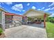 Outdoor kitchen with built-in grill and stone accents, adjacent to a covered picnic area at 305 Decanting Ln, Fort Mill, SC 29707