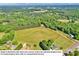 Aerial view of a large lot with mature trees and a beautiful home at 3610 Providence Mill Rd, Maiden, NC 28650