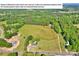 Aerial view of the property with a outlined lot line and lush surrounding landscape at 3610 Providence Mill Rd, Maiden, NC 28650