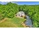 Stunning aerial view of a home surrounded by lush greenery and a winding driveway at 3610 Providence Mill Rd, Maiden, NC 28650
