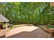 Relaxing outdoor space, featuring a wooden deck surrounded by lush greenery at 3610 Providence Mill Rd, Maiden, NC 28650