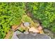 Aerial view of deck and gazebo with beautiful landscaping in a lush, wooded backyard at 3610 Providence Mill Rd, Maiden, NC 28650