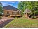 Beautifully landscaped backyard featuring a large deck and gazebo at 3610 Providence Mill Rd, Maiden, NC 28650