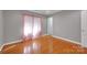 Bright bedroom featuring hardwood floors, light grey walls and neutral trim at 3610 Providence Mill Rd, Maiden, NC 28650