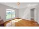 Bright bedroom with hardwood floors, a large window, and white walls at 3610 Providence Mill Rd, Maiden, NC 28650