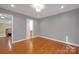 This spacious bedroom features hardwood floors and neutral paint, offering a blank canvas at 3610 Providence Mill Rd, Maiden, NC 28650
