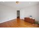 Bedroom featuring hardwood floors, a large window, and white walls at 3610 Providence Mill Rd, Maiden, NC 28650