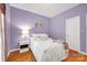 Comfortable bedroom with purple walls, white trim, and hardwood floors at 3610 Providence Mill Rd, Maiden, NC 28650