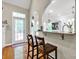 Kitchen breakfast bar featuring granite countertop with pendant lighting and a view into the breakfast nook at 3610 Providence Mill Rd, Maiden, NC 28650
