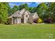 Beautiful two-story home with a well-manicured lawn and colorful landscaping at 3610 Providence Mill Rd, Maiden, NC 28650