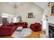 Spacious living room with high ceilings, a fireplace, and large windows offering abundant natural light at 3610 Providence Mill Rd, Maiden, NC 28650