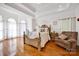 Serene main bedroom with tray ceiling, hardwood floors, and sitting area at 3610 Providence Mill Rd, Maiden, NC 28650