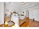 Comfortable main bedroom featuring hardwood floors, tray ceilings, and ample natural light at 3610 Providence Mill Rd, Maiden, NC 28650