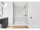 Elegant bathroom featuring a modern shower with marble-style tiling and updated fixtures at 424 Airline Ave, Shelby, NC 28150