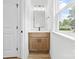 Updated powder room with modern vanity, granite countertops, and stylish lighting fixtures at 424 Airline Ave, Shelby, NC 28150