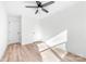 Bright bedroom featuring neutral walls, wood-look flooring, and a ceiling fan at 424 Airline Ave, Shelby, NC 28150