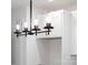 Stylish chandelier with exposed bulbs in the kitchen, complemented by white cabinets at 424 Airline Ave, Shelby, NC 28150