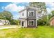 Charming two-story home with a modern gray and white exterior and newly planted landscaping at 424 Airline Ave, Shelby, NC 28150