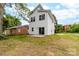 Two-story home with a patio in the backyard with glass sliding doors leading into the house at 424 Airline Ave, Shelby, NC 28150