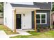 Charming home featuring a black front door and porch with wooden support beams at 424 Airline Ave, Shelby, NC 28150
