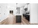 Modern kitchen featuring stainless appliances, an island, quartz countertops, hardwood flooring, and ample storage at 424 Airline Ave, Shelby, NC 28150