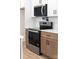 Modern kitchen with stainless steel appliances, light wood cabinets, and white countertop at 424 Airline Ave, Shelby, NC 28150