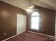 Bedroom with a ceiling fan and a arched window for natural light at 4409 Homestead Rd, Rock Hill, SC 29732