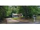 View of home with a front yard, carport, and well-maintained landscaping providing a serene setting at 4409 Homestead Rd, Rock Hill, SC 29732