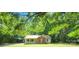 Charming single-Gathering home featuring a cozy front porch and a brick facade surrounded by mature trees at 4409 Homestead Rd, Rock Hill, SC 29732