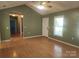 Another shot of the living room featuring lots of natural light, hardwood floors and a modern ceiling fan at 4409 Homestead Rd, Rock Hill, SC 29732