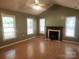 Bright living room with hardwood floors, fireplace, and lots of natural light through large windows at 4409 Homestead Rd, Rock Hill, SC 29732