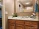Bathroom vanity features wood cabinets, a white countertop and decorative elements at 4409 Homestead Rd, Rock Hill, SC 29732
