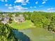A beautiful backyard and pond are featured in this aerial view of the home at 458 Inverness Pl, Rock Hill, SC 29730