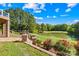 Backyard with landscaping, a lake, and view of the home with a walkout basement at 458 Inverness Pl, Rock Hill, SC 29730