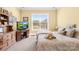 Comfortable bedroom with a view of the yard and a wooden dresser and desk at 458 Inverness Pl, Rock Hill, SC 29730