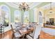 Charming dining room featuring an elegant chandelier, ample natural light, and stylish decor at 458 Inverness Pl, Rock Hill, SC 29730