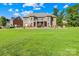 Large house with a brick exterior, a well-maintained lawn, and a walkout basement at 458 Inverness Pl, Rock Hill, SC 29730