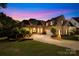 Charming brick home with a manicured lawn, mature trees, and a circular driveway during twilight hours at 458 Inverness Pl, Rock Hill, SC 29730