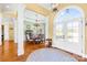 Elegant foyer with hardwood floors, arched windows, and an ornate chandelier at 458 Inverness Pl, Rock Hill, SC 29730