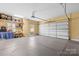 Spacious garage with ample storage shelving, a two-car door, and plenty of open space for parking at 458 Inverness Pl, Rock Hill, SC 29730